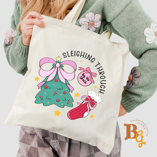 sleighing through by grace tote bag